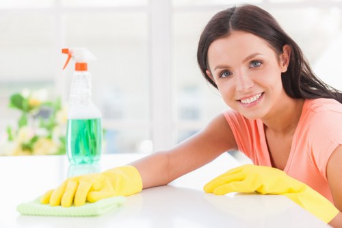 Technician preparing carpet cleaning equipment safely before service