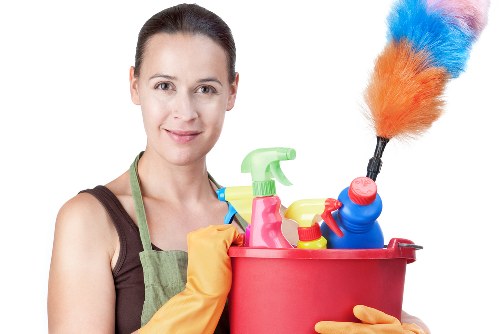 Carpet cleaning technician preparing equipment for a booked service